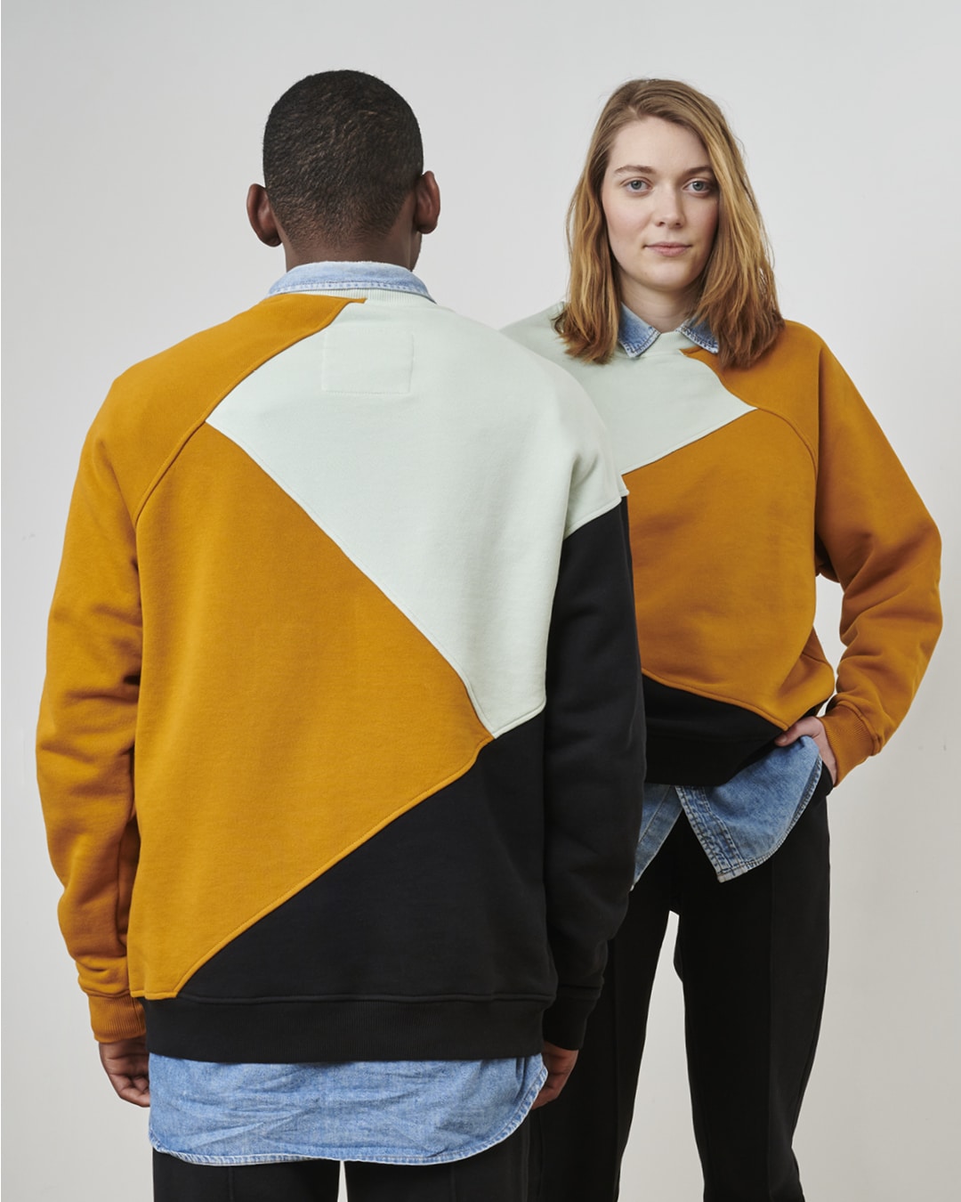 Woman's sweatshirt in yellow, black and turqoise colour block pattern